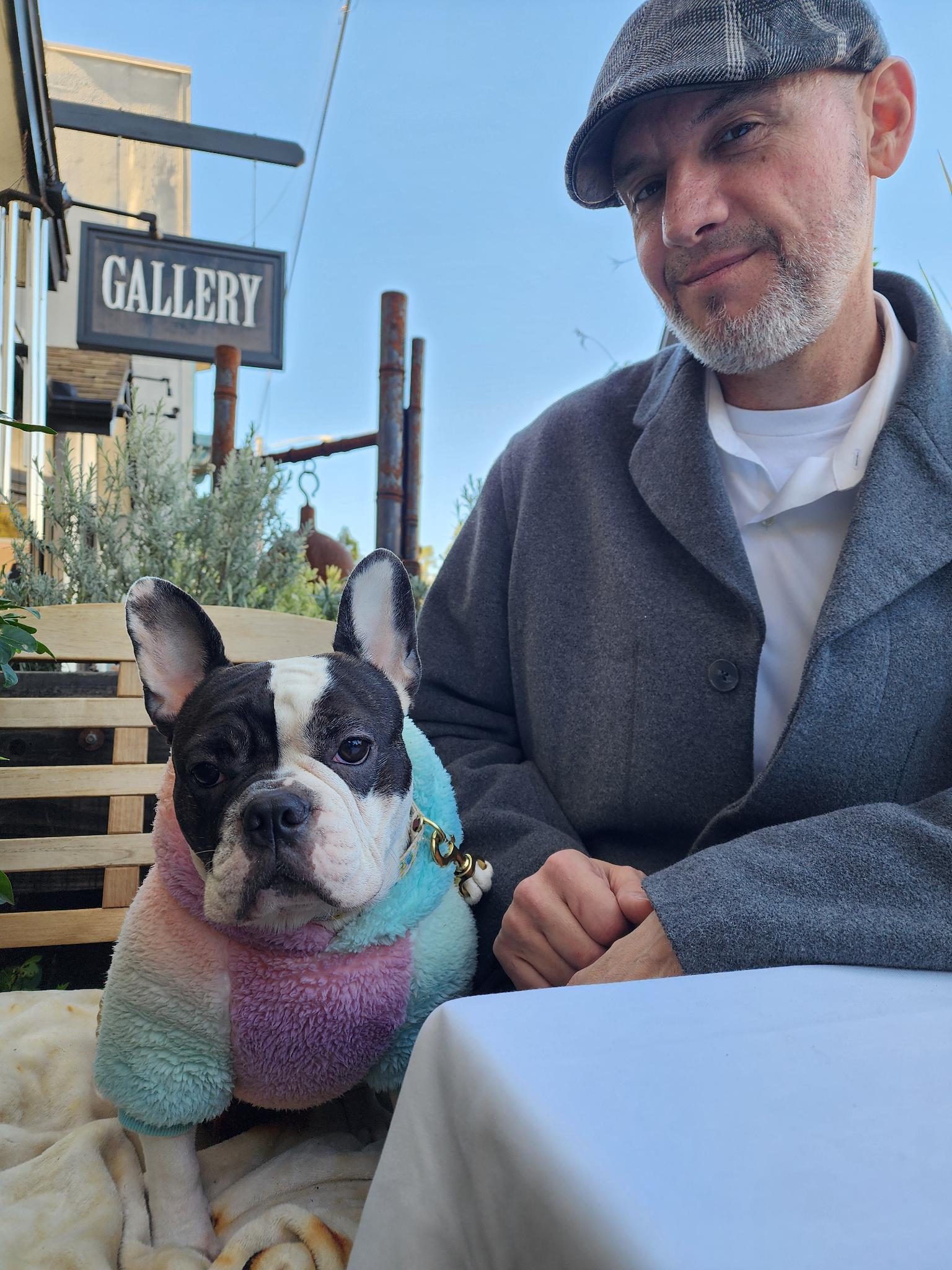 Gregory with our little dog at the wedding-dinner table