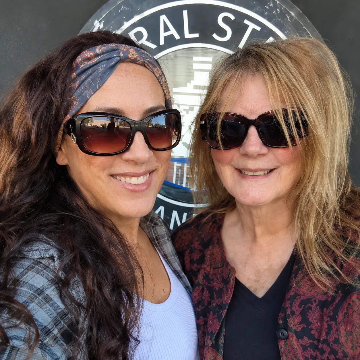 Karen and Andie smiling together in sunglasses