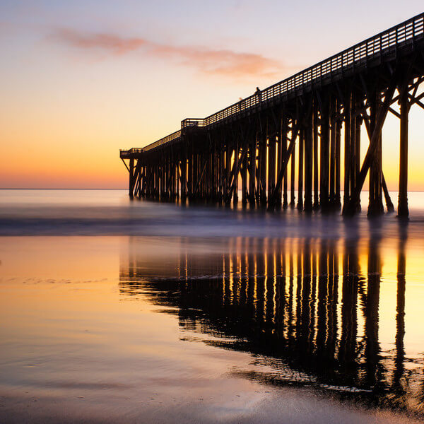 San Simeon pier reflected in the shore at sunset
