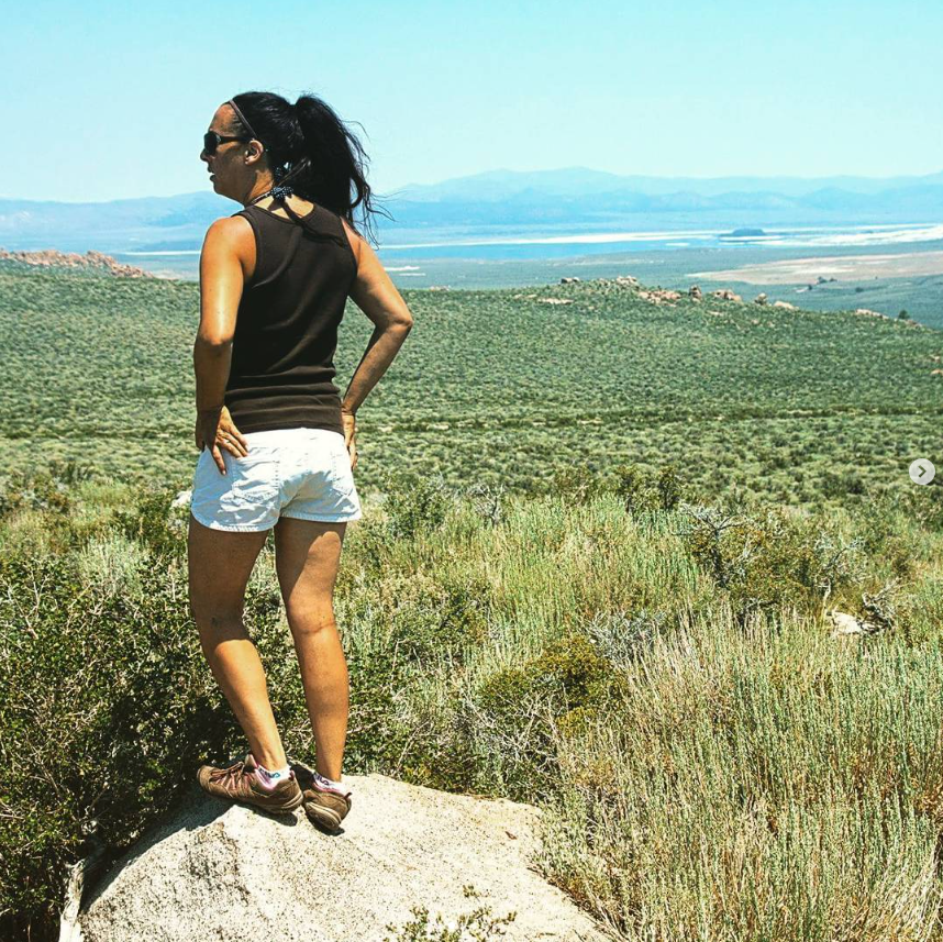 Andie looking out from a rocky overlook