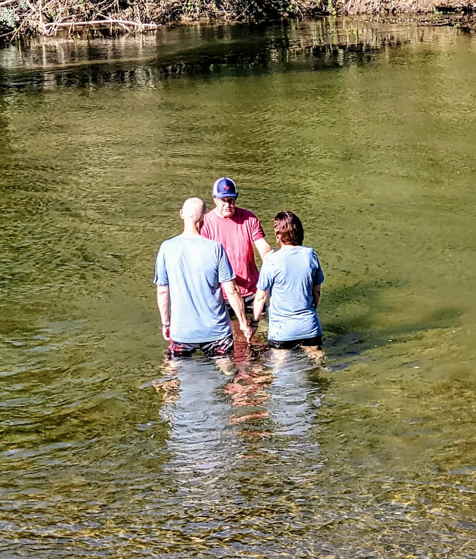 Andie and Gregory being baptized together in California living water